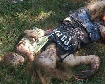 2014 г.. Работа карателей в Горловке  на  Донбасе. Молоденькая мама Кристина и ее годовалая малютка Кира. Они убиты за то, что были русскими. 